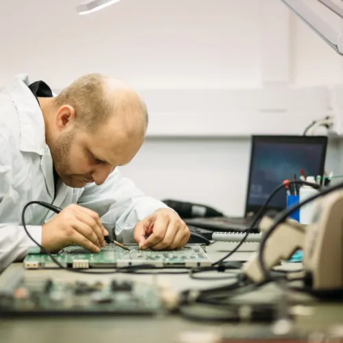 man in lab working on chip